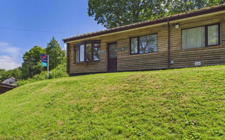 Property photo 1 of 9 Exterior View Of The Timber Clad Lodge Set On A Grassy Plot
