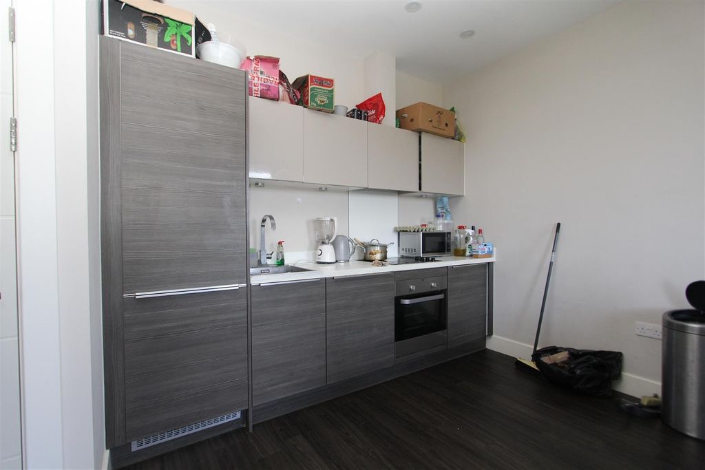 Property photo 3 of 6 Modern Kitchen With Stylish Grey Wood Cabinets...