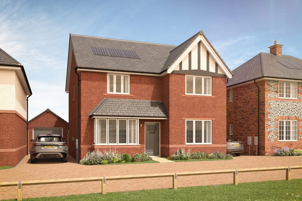 Property photo 1 of 10 A Two-Story Brick House With A Gabled Roof, Surrounded By A Grassy Yard And A Wooden Fence