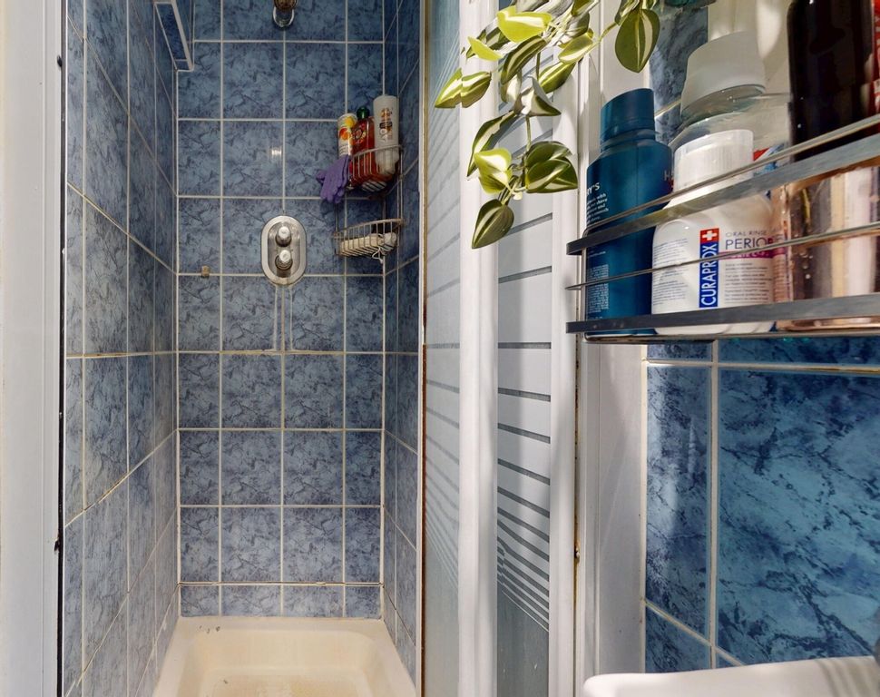 Property photo 2 of 12 A Clean And Bright Bathroom Featuring A Spacious S...
