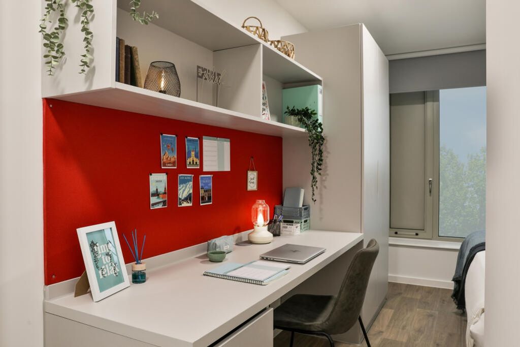 Property photo 3 of 6 A Stylish Double Bedroom Featuring A Vibrant Red A...