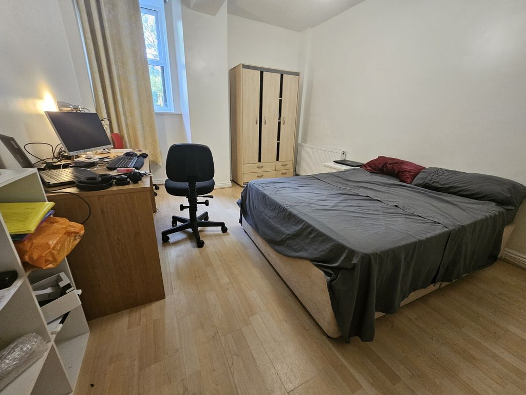 Property photo 3 of 10 A Spacious Master Bedroom Featuring A Large Bed, A...