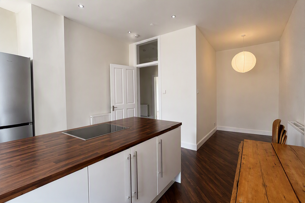 Property photo 3 of 7 Kitchen + Dining Room