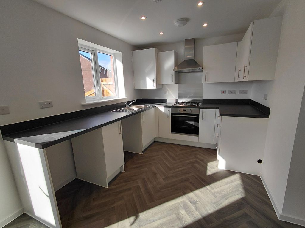 Property photo 3 of 12 Typical Kitchen