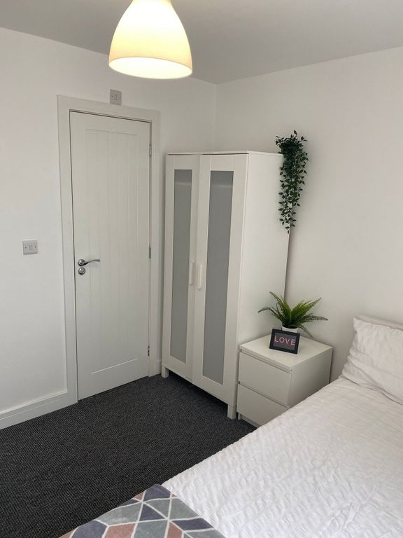 Property photo 3 of 21 This Inviting Double Bedroom Features A Bright Atm...