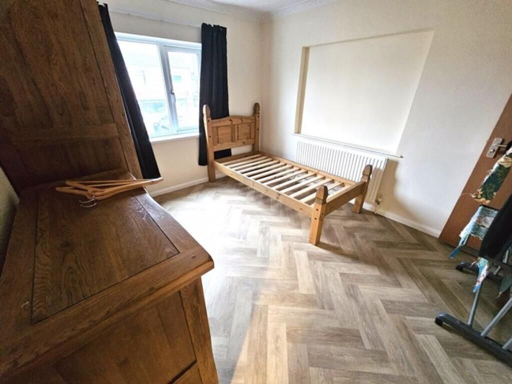 Property photo 3 of 5 A Tidy Single Bedroom Featuring A Wooden Bed Frame...