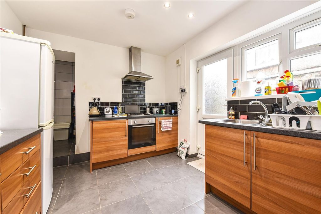 Property photo 1 of 8 Bright Kitchen With Modern Wood-Style Cabinetry...