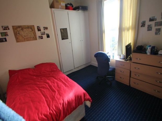 Property photo 2 of 14 A Cozy Bedroom Featuring A Comfortable Bed With A ...