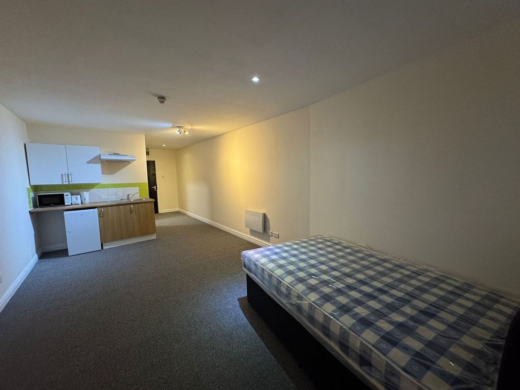 Property photo 1 of 2 A Spacious Living Room With A Comfortable Bed And ...