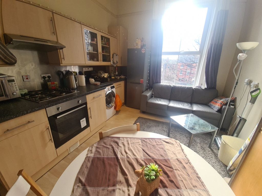 Property photo 3 of 10 Bright And Functional Kitchen Space Featuring Mode...