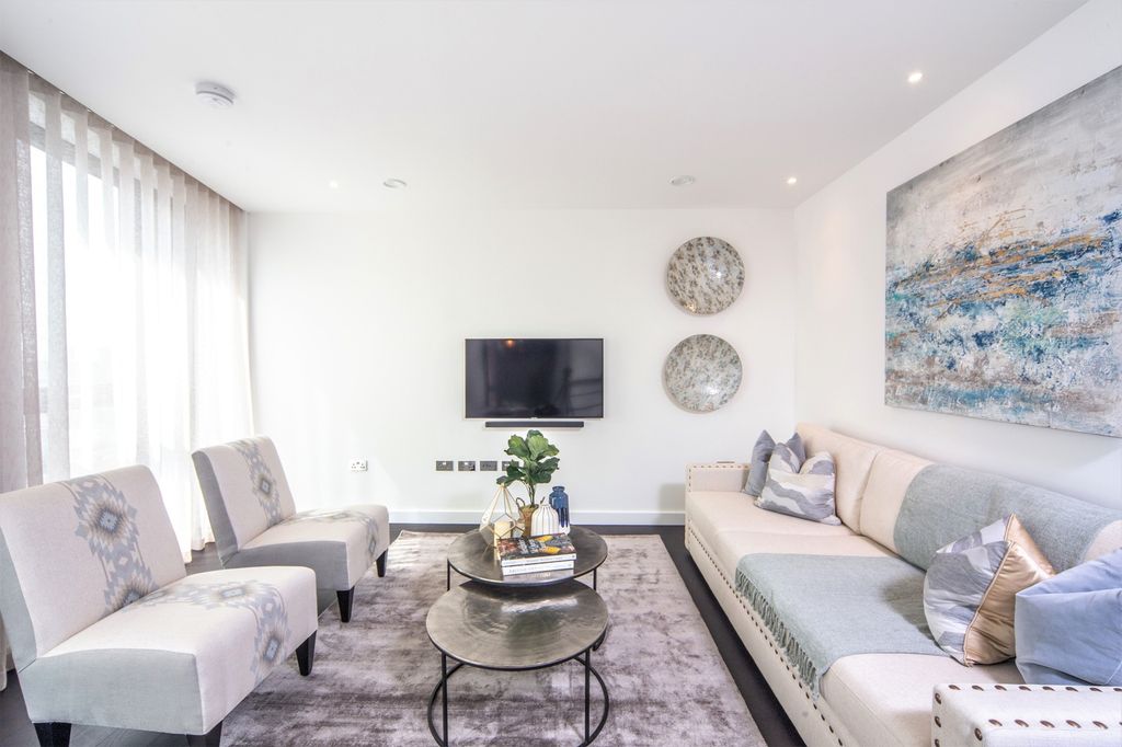 Property photo 3 of 11 Bright And Stylish Living Room Featuring Contempor...