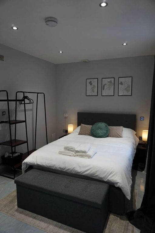Property photo 1 of 8 A Neatly Arranged Double Bedroom Featuring A Comfo...