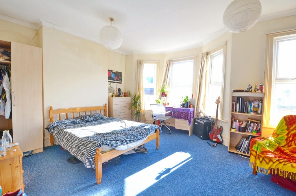 Property photo 2 of 13 Bright And Spacious Master Bedroom Featuring A Lar...