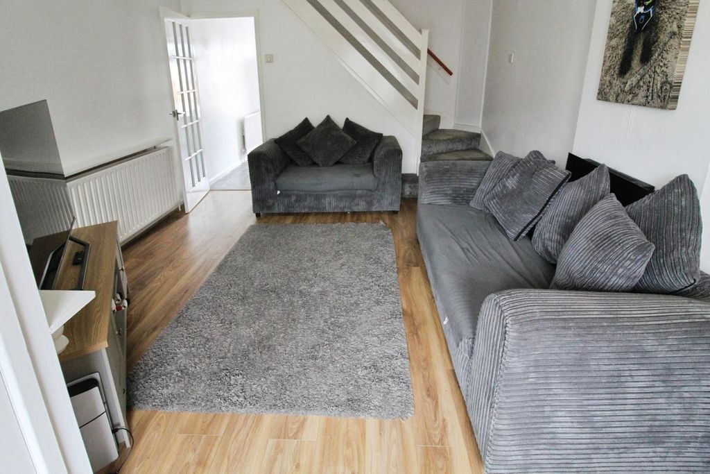 Property photo 3 of 12 Living Room: