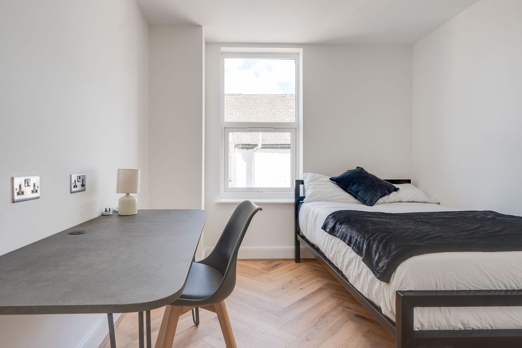 Property photo 3 of 5 A Clean And Bright Bedroom Featuring A Comfortable...