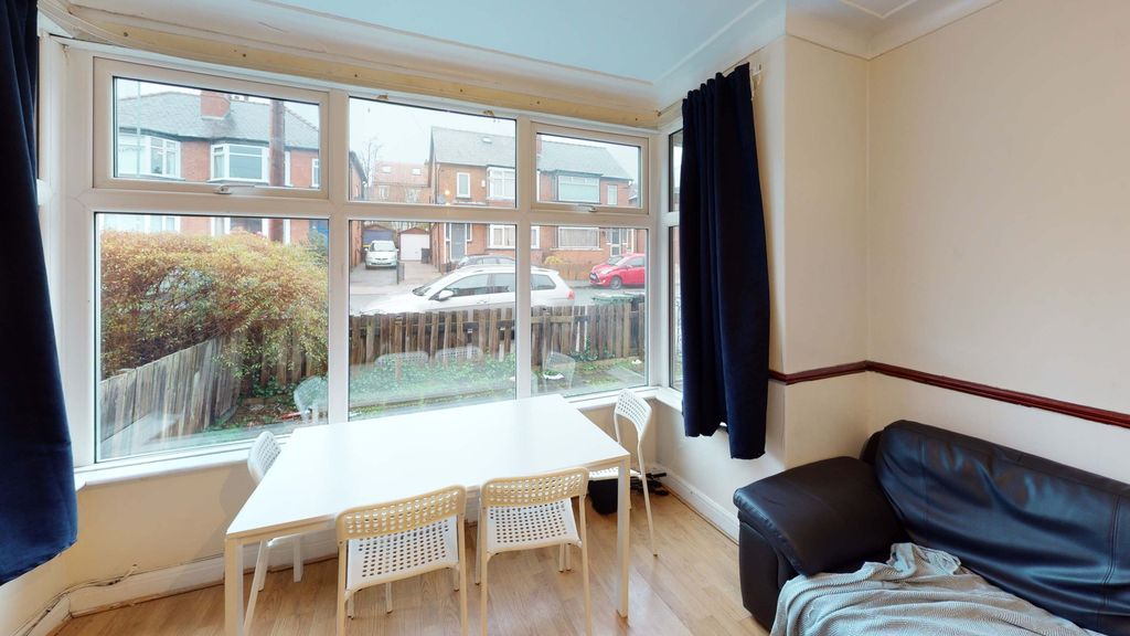 Property photo 3 of 6 A Bright And Welcoming Living Room With Large Wind...