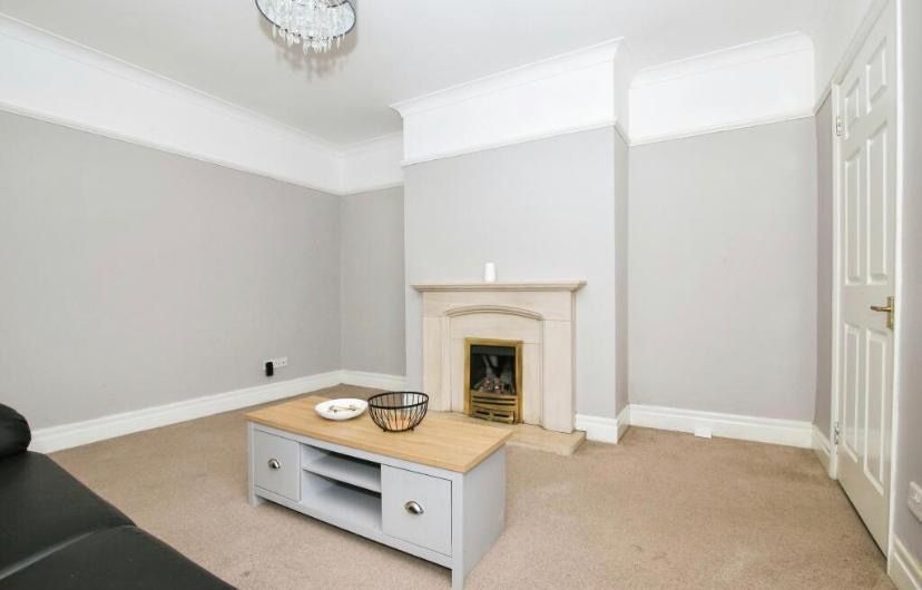 Property photo 1 of 9 Bright, Neutral Living Room With A Decorative Fire...