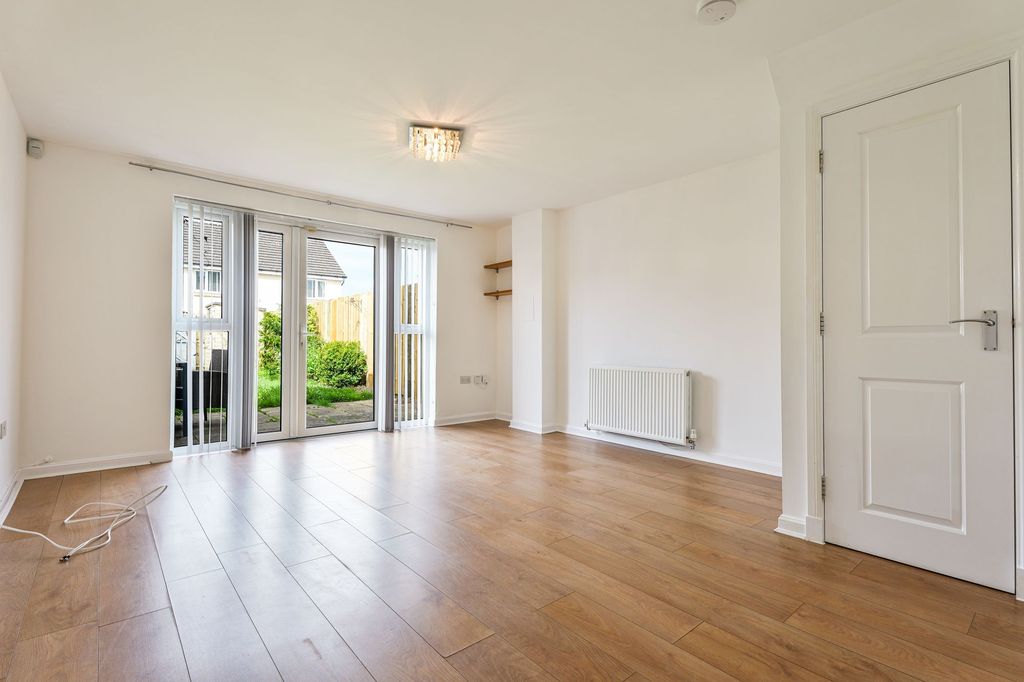 Property photo 2 of 20 Spacious Lounge With View To Rear Garden Via French Doors