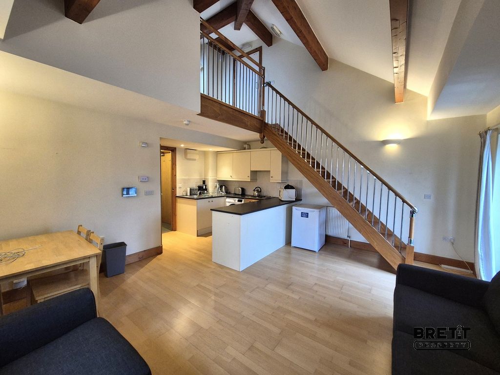 Property photo 2 of 8 Kitchen-Dining And Living Room