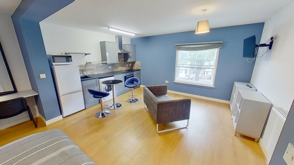 Property photo 1 of 4 This Inviting Living Area Features Modern Furnishi...