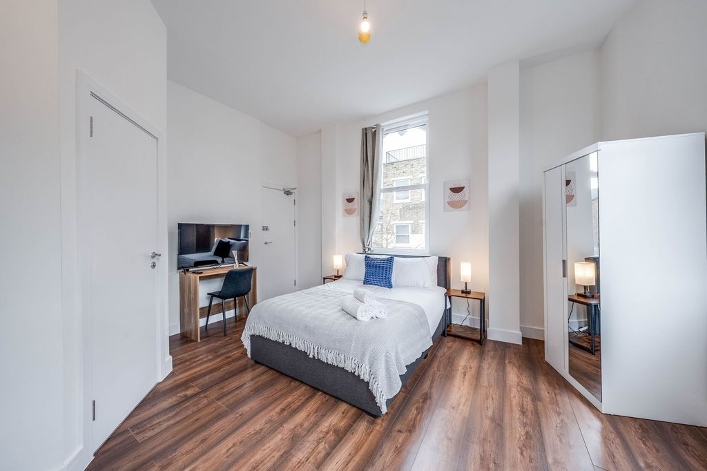 Property photo 1 of 8 Bright And Spacious Master Bedroom Featuring A Com...