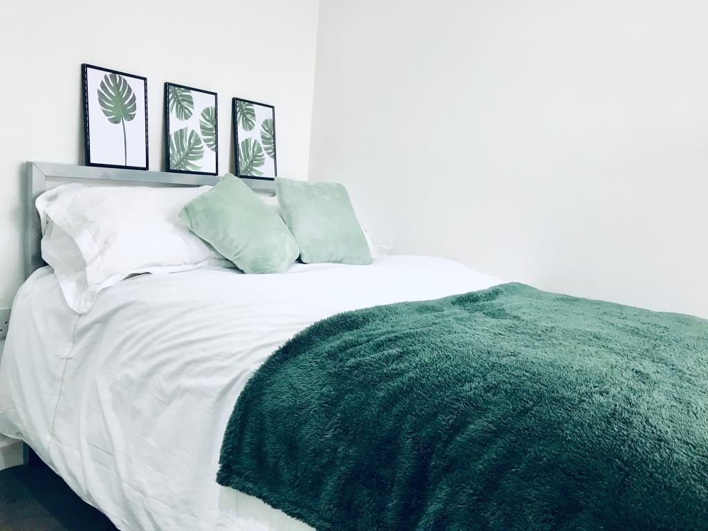 Property photo 2 of 12 Bright And Inviting Master Bedroom Featuring A Com...