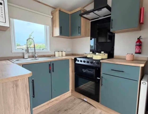 Property photo 3 of 12 Contemporary Kitchen With Green Cabinets, Wood Effect Worktops And Cooker
