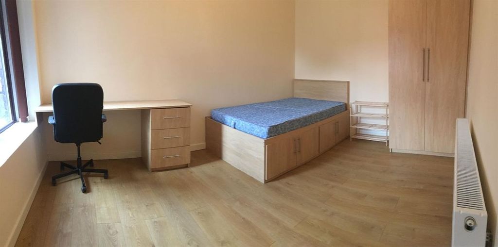 Property photo 2 of 13 Bright Bedroom With Desk And Ample Storage Space...