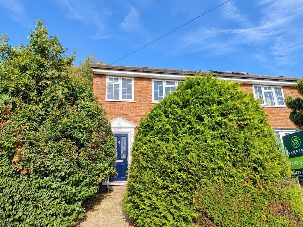 Property photo 2 of 17 Brick House Framed By Lush Hedges.Png