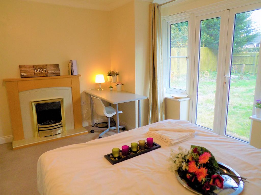 Property photo 2 of 27 A Cozy And Bright Master Bedroom Featuring A Comfo...