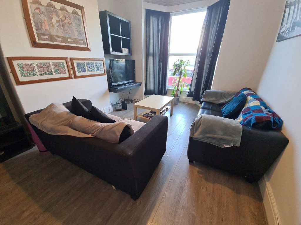 Property photo 1 of 9 A Cozy And Well-Kept Living Room Featuring Two Com...