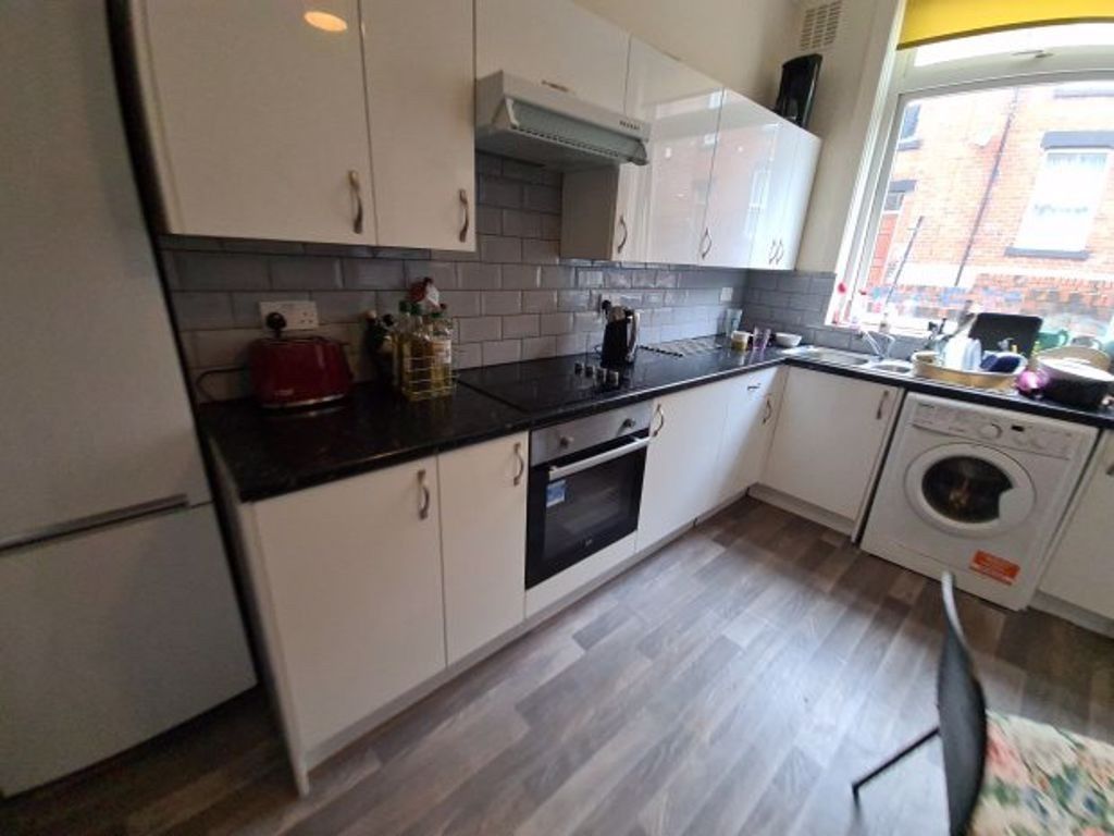 Property photo 3 of 9 Bright And Modern Kitchen With Ample Countertop Sp...