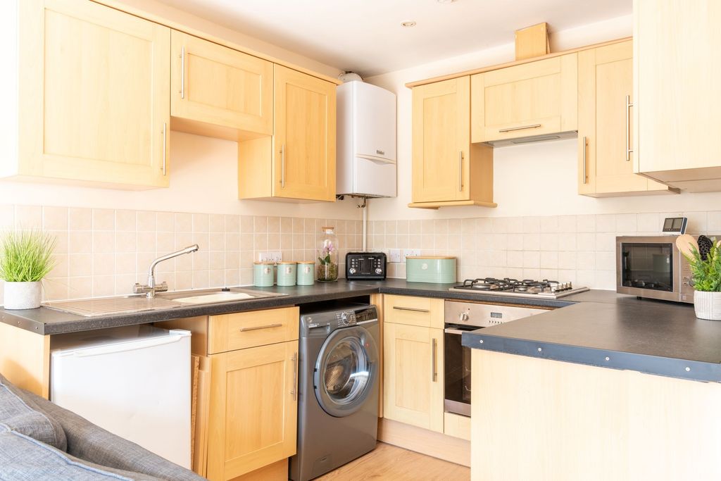 Property photo 1 of 9 Bright Modern Kitchen With Light Wood Cabinets, Bl...