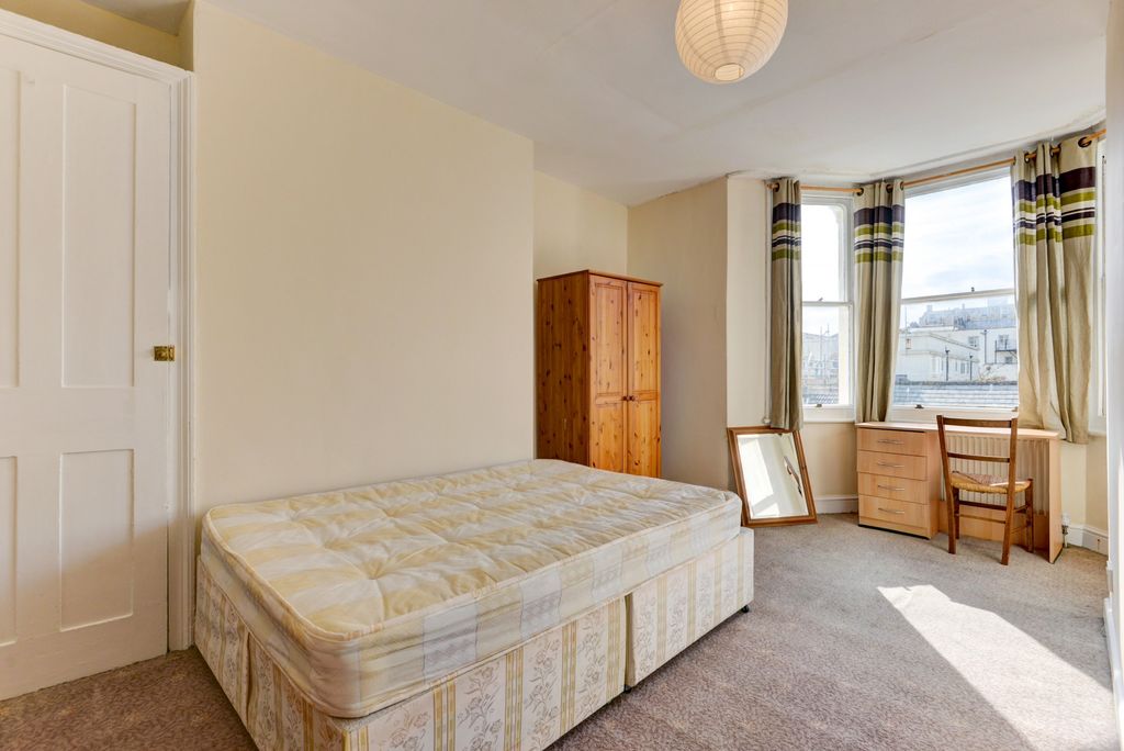 Property photo 1 of 15 A Spacious Master Bedroom Featuring A Large Bed, F...