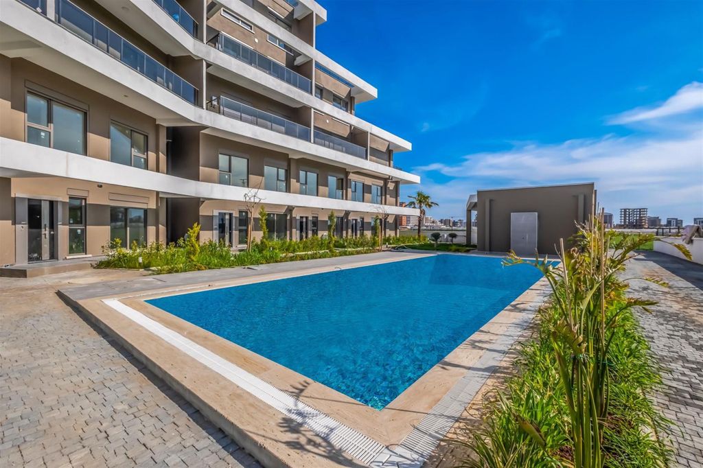 Property photo 2 of 16 Spacious One-Bedroom Apartment For Sale In Antalya - Communal Swimming Pool