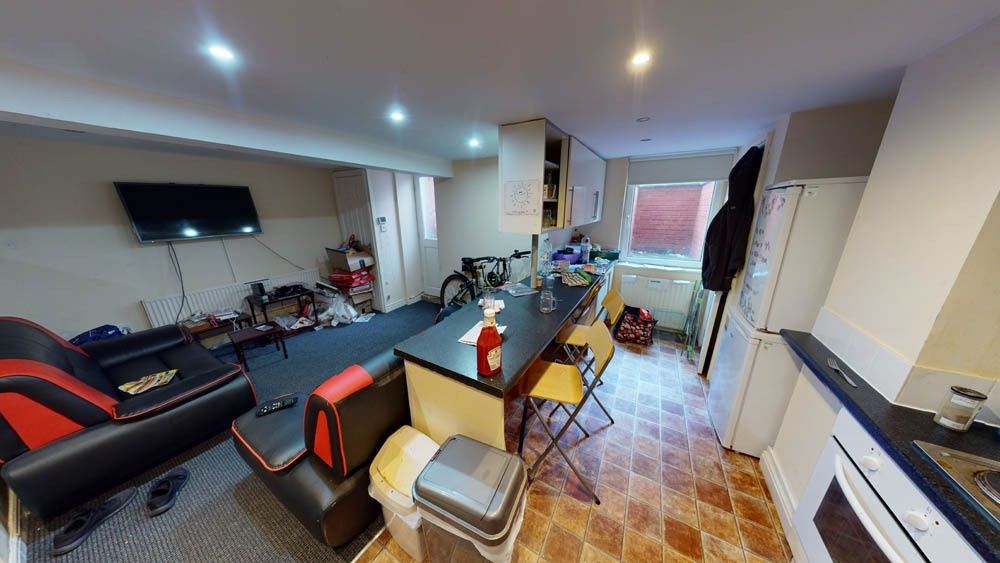 Property photo 2 of 20 A Spacious And Well-Lit Living Room Featuring Mode...