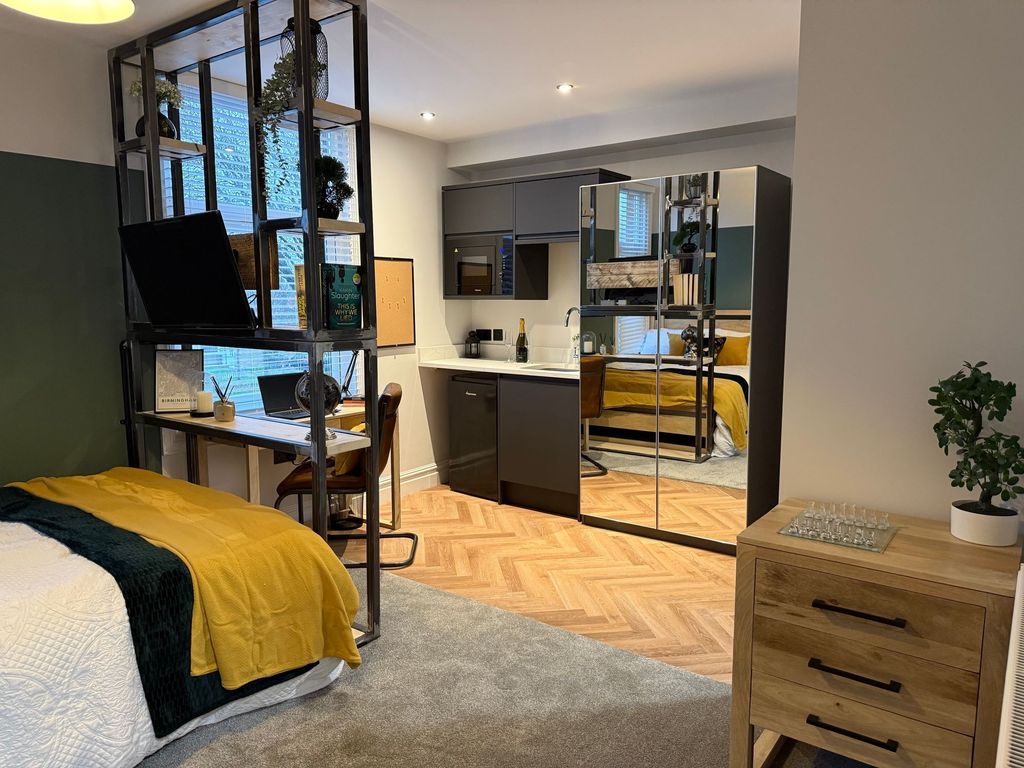 Property photo 2 of 5 A Stylish Master Bedroom Featuring A Cozy Double B...