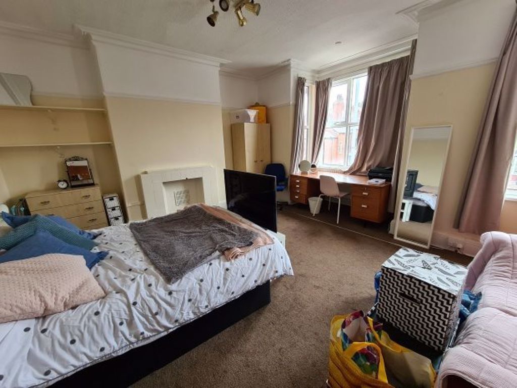 Property photo 3 of 21 A Spacious Master Bedroom Featuring A Comfortable ...