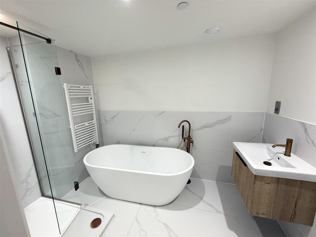 Property photo 3 of 8 Elegant Marble Bathroom With Freestanding Bath...
