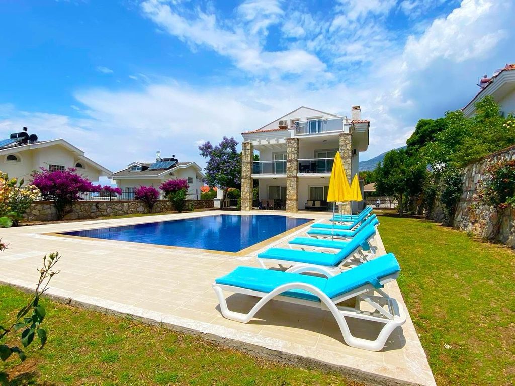 Property photo 1 of 21 An Immaculate Fethiye Property For Sale – Main View Of The Triplex Villa And Pool