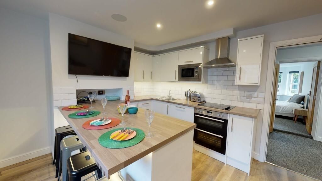 Property photo 3 of 8 Bright And Modern Kitchen Featuring A Spacious Isl...