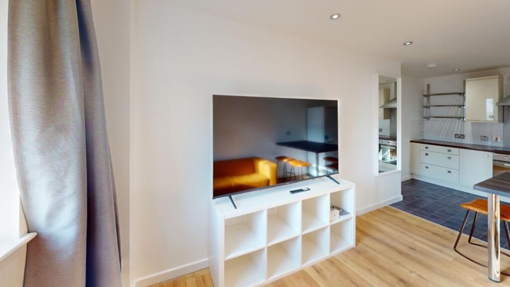 Property photo 2 of 11 A Bright And Inviting Living Room Featuring Modern...