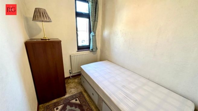 Property photo 1 of 15 A Compact, Well-Lit Bedroom Featuring A Single Bed...