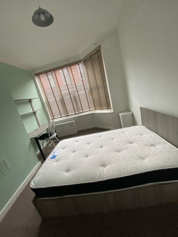 Property photo 3 of 12 A Spacious And Well-Lit Double Bedroom Featuring A...
