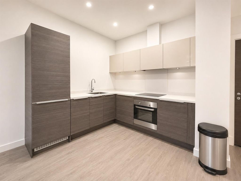 Property photo 2 of 5 Sleek Modern Kitchen With Stylish Wood Finish...