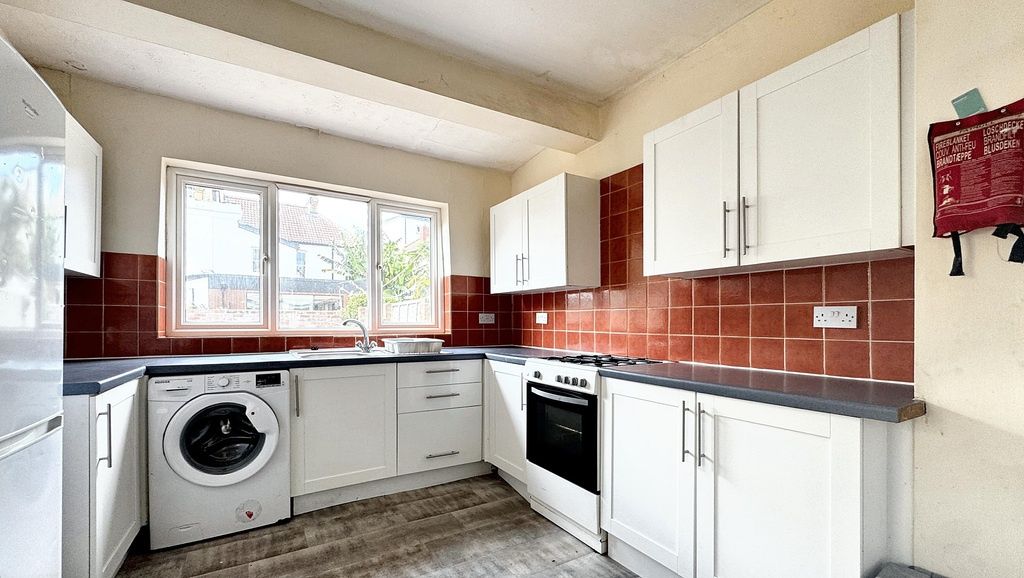 Property photo 3 of 9 A Bright And Well-Maintained Kitchen Featuring Whi...