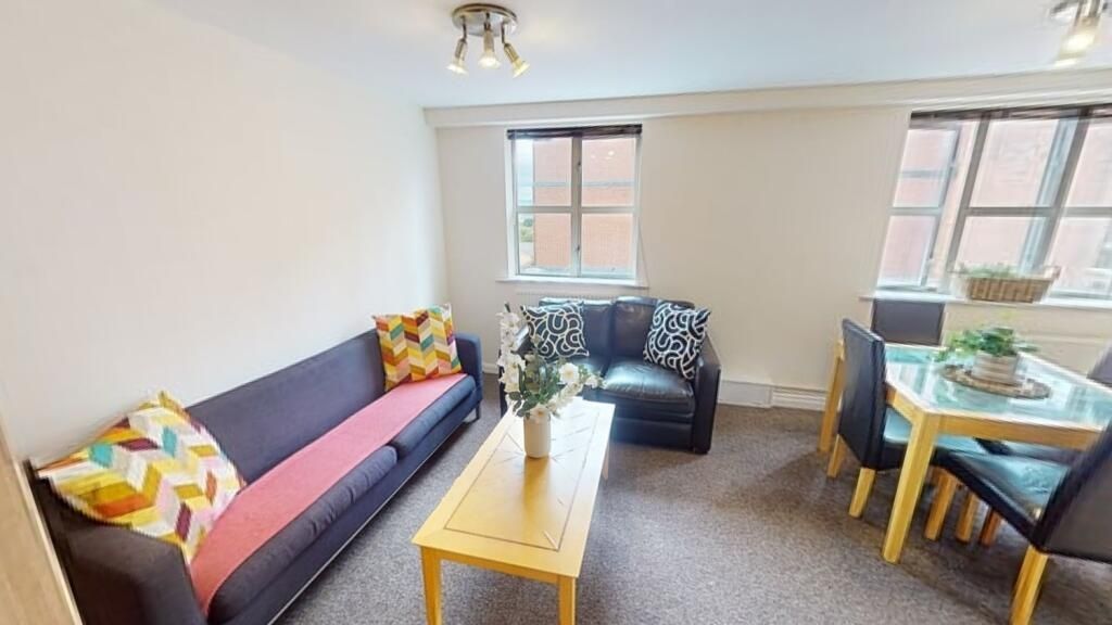 Property photo 1 of 6 Bright And Welcoming Living Room Featuring Comfort...