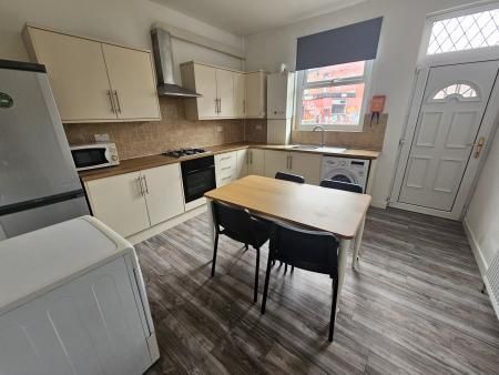 Property photo 2 of 8 Bright And Modern Kitchen Featuring A Spacious Lay...