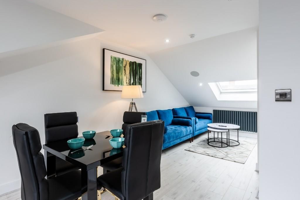 Property photo 1 of 10 Bright And Modern Living Room Featuring Contempora...