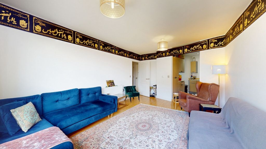 Property photo 1 of 8 A Cozy And Inviting Living Room Featuring Two Comf...